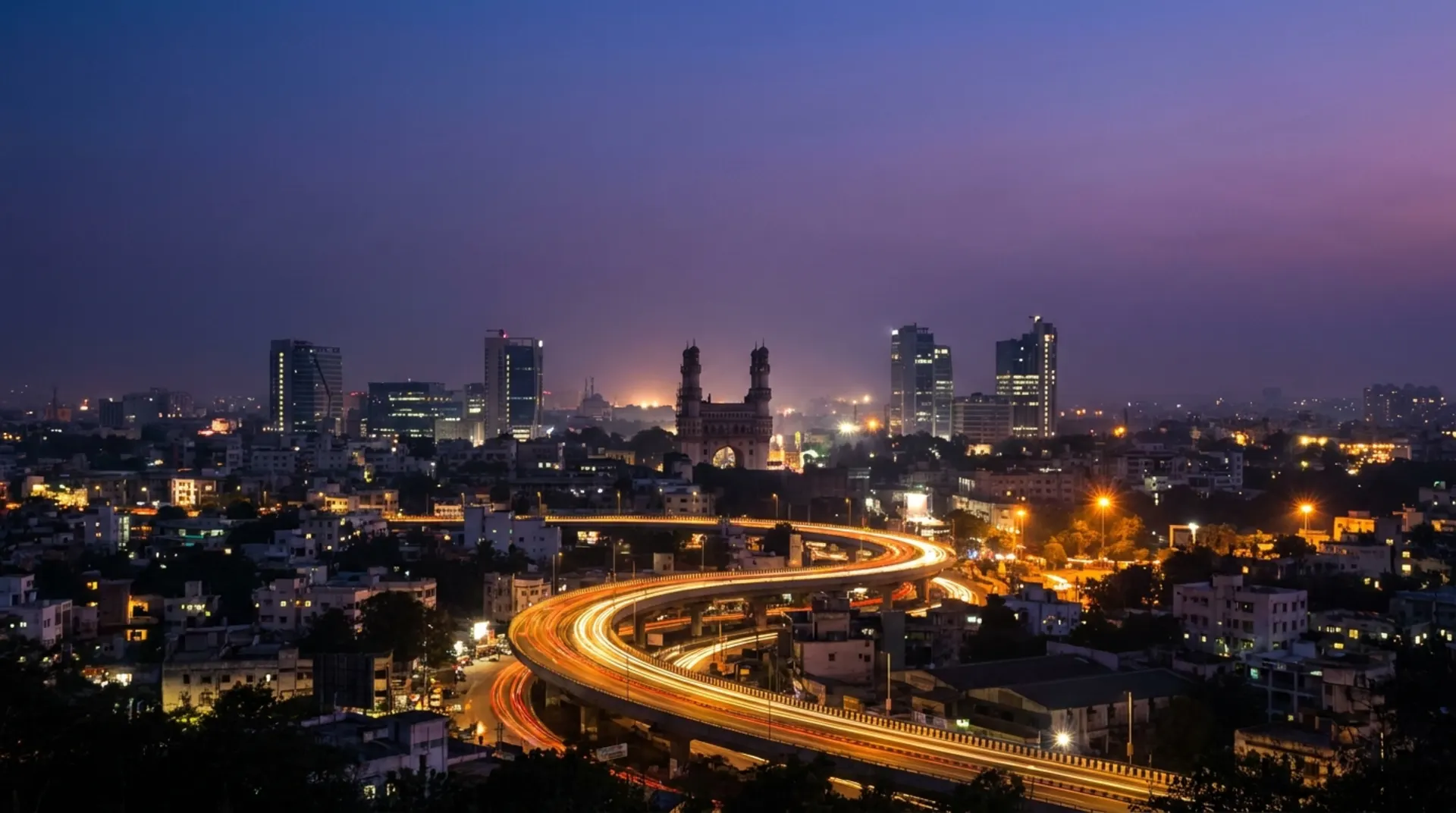 Hyderabad city skyline with Charminar at dusk, starting point for Guntur trips